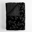 Bella Notte Lynette throw blanket in Tahoe Blue, soft and cozy fabric, draped for display.