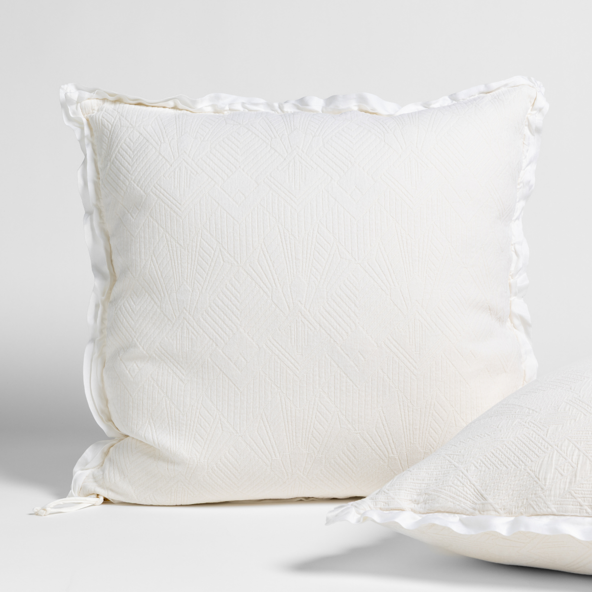 Bella Notte Trettino Sham in a cozy, textured fabric with a subtle autumn-inspired design, perfect for elegant bedroom decor.