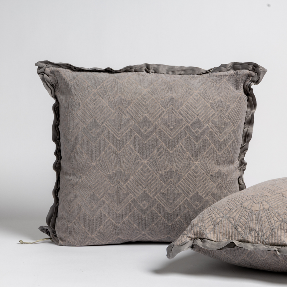 Bella Notte Trettino Sham in autumn-colored fabric, showcasing soft textile with elegant stitching details.