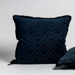 Bella Notte Trettino Sham in a cozy, textured fabric, displayed alongside matching throw pillows in warm autumn tones.