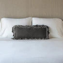 Bella Notte Loulah throw pillow with autumn-colored fabric and decorative bolster design on soft, cozy fabric.