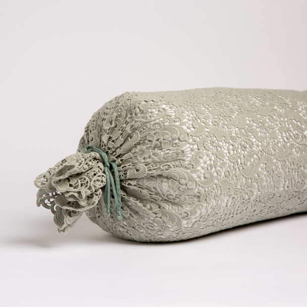 Bella Notte Allora Lace Bolster Cover on a throw pillow with delicate lace details and soft fabric in a cozy, elegant design.
