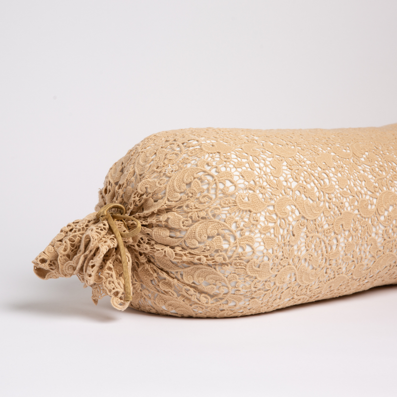 Bella Notte Allora Lace Bolster Cover on a throw pillow with intricate lace detailing and soft fabric.