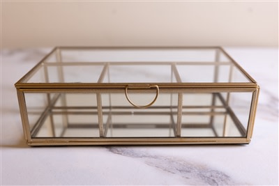 Four-section glass and brass box by BIDK, featuring a stylish multi-compartment design for elegant storage.