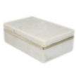 Small white marble box with brass inlay, crafted by BIDK, featuring a smooth surface and elegant decorative design.