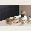 Dark green Asiatic Pheasants half pint mug by Burleigh featuring detailed bird and foliage design on ceramic surface.