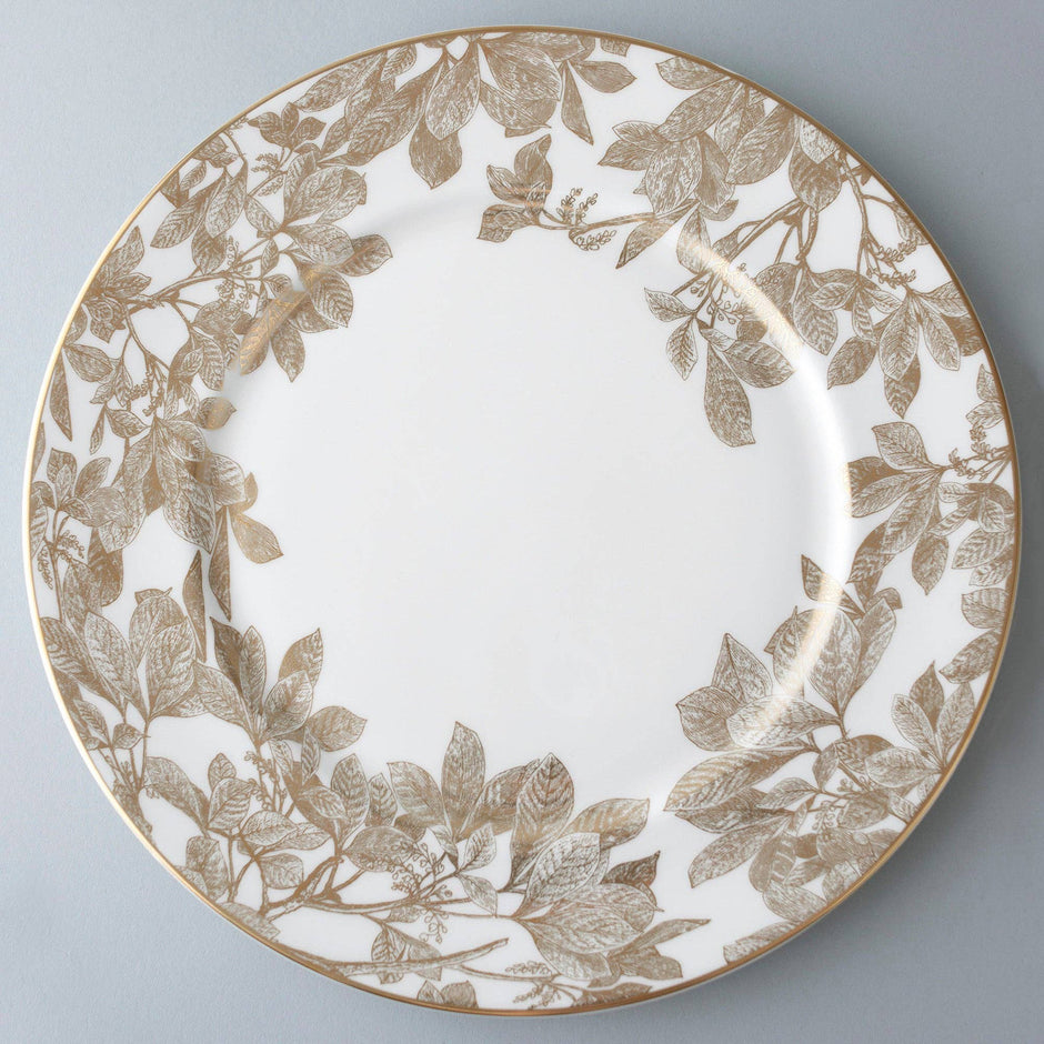 Caskata Arbor Gold Rimmed Charger dishware with elegant gold trim and decorative pattern, showcasing sophisticated tableware design.