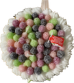 Cereria Introna blackberry cake pillar candle with green icing and candle flame, decorative and scented home decor.