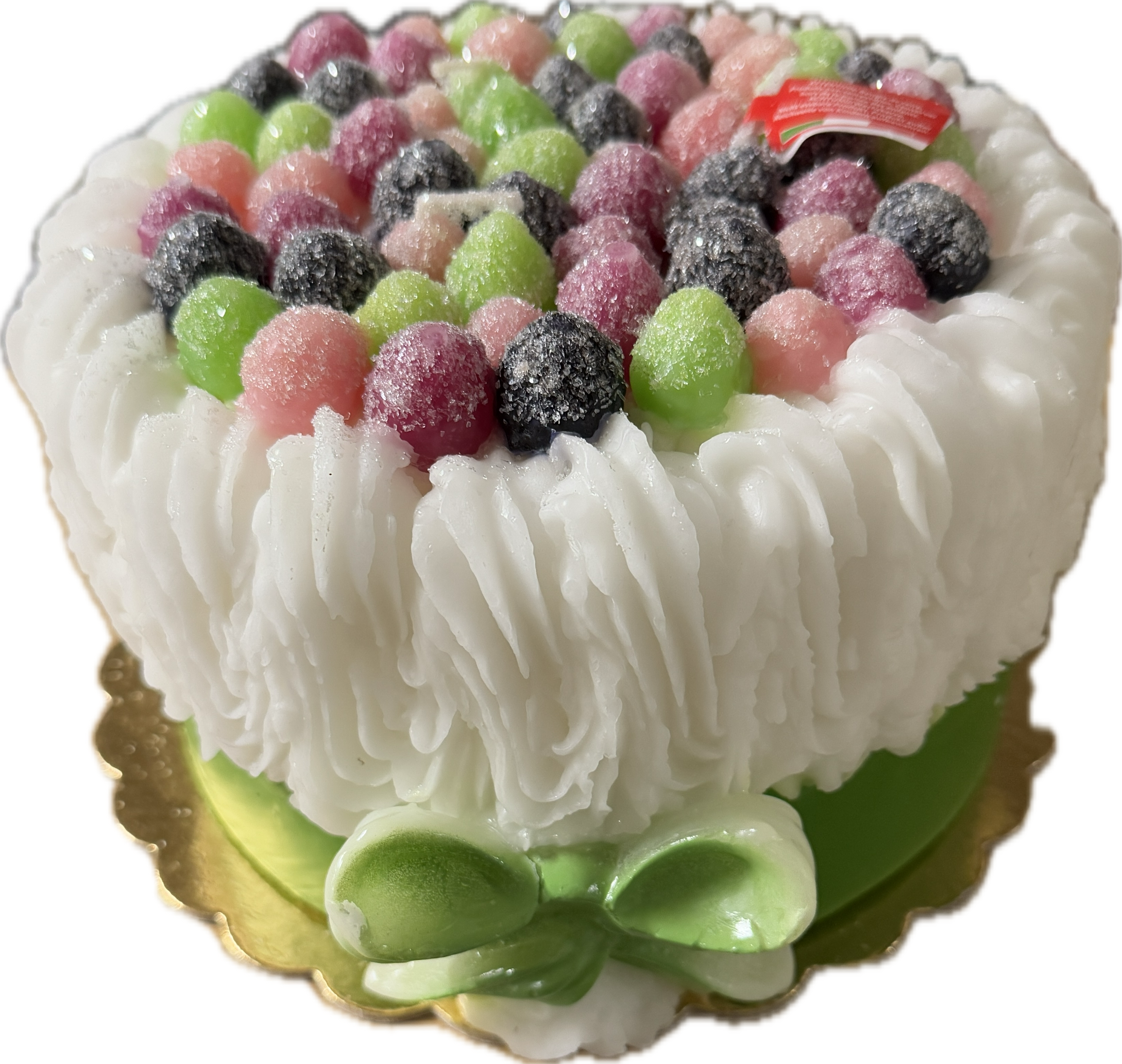Cereria Introna Blackberry Cake pillar candle with green icing and candle wick, showcasing a decorative and fragrant candle design.