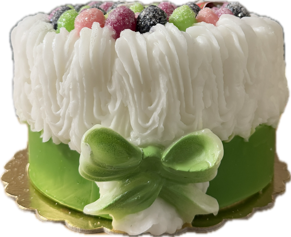 Cereria Introna blackberry cake pillar candle with green icing and candle wick, decorative dessert-inspired design.