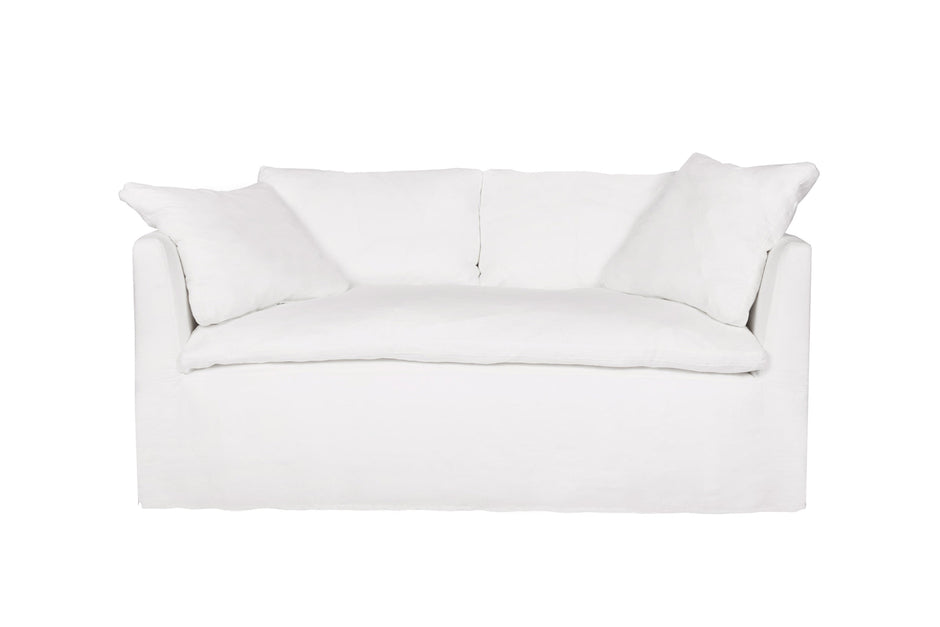 Cisco Havana curved slipcovered loveseat in white linen, 72-inch, showcasing plush cushions and elegant design.