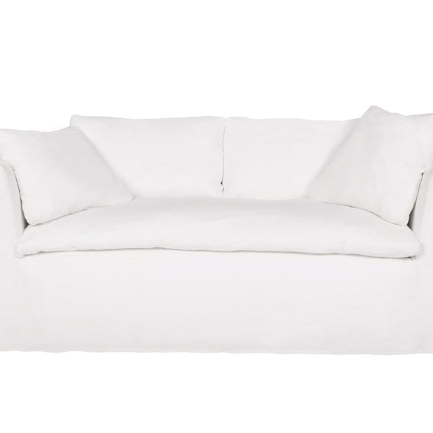 Cisco Havana curved slipcovered loveseat in white linen, 72-inch, showcasing plush cushions and elegant design.