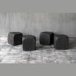 Black teak dice cube side table by Clubcu/Blaxsand showing a modern, geometric design with a smooth black finish.