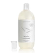 Common Good lavender gentle laundry detergent bottle with cap, showcasing the eco-friendly packaging of the laundry product.