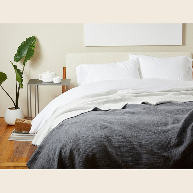 Coyuchi organic cotton blanket in charcoal, king size, soft and cozy bedding for a comfortable sleep.