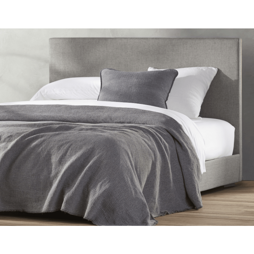 Coyuchi organic cotton blanket in charcoal for king-size bed, soft and cozy home bedding made from natural materials.