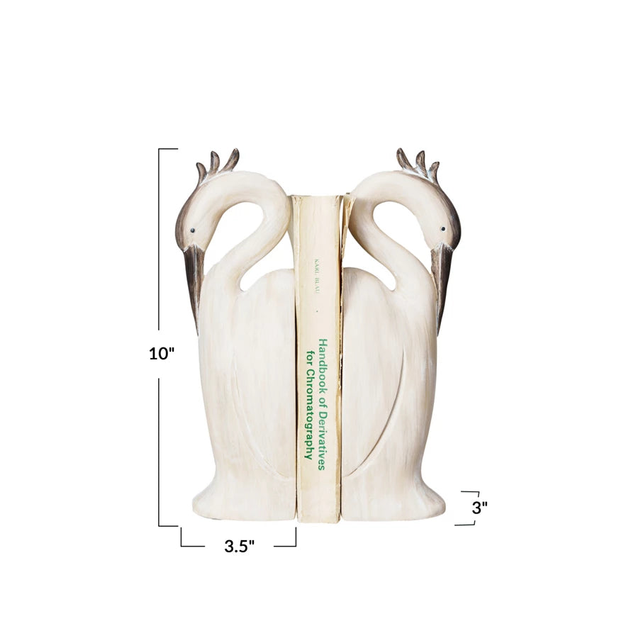 Set of two Creative Co-op heron-shaped bookends with detailed bird designs, perfect for organizing books on a shelf.