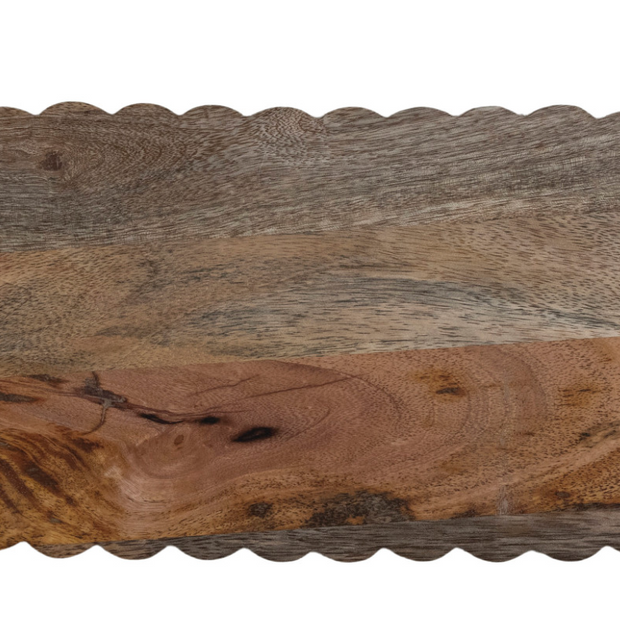 Oval mango wood cheese and serving board with scalloped edges, ideal for cheese and charcuterie presentation by Creative Co-op