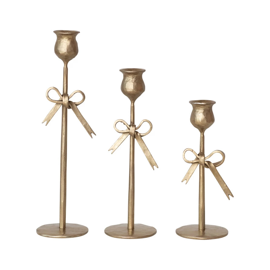 Set of three antique gold bow taper holders by Creative Co-op, featuring elegant bow design for decorative candle display.