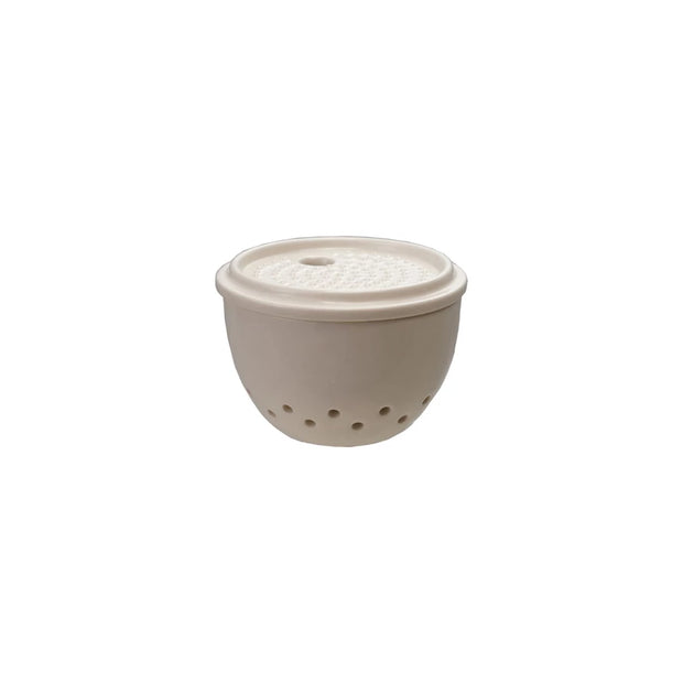 Creative Co-op grater with attached storage container for easy grating and storing shredded foods.