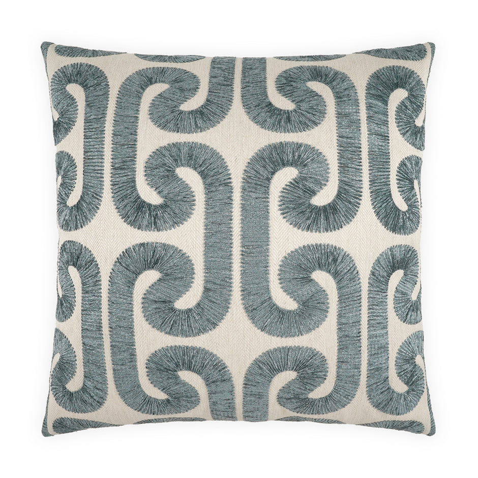 Decorative pillow with blue geometric pattern on a white background