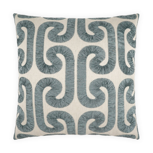 Decorative pillow with blue geometric pattern on a white background