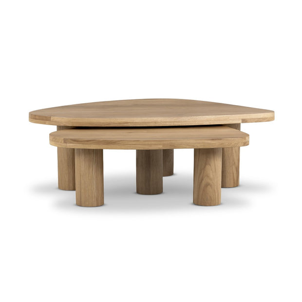 Pair of natural oak Zion nesting coffee tables by Four Hands, showcasing modern wooden design and versatile table sizes.