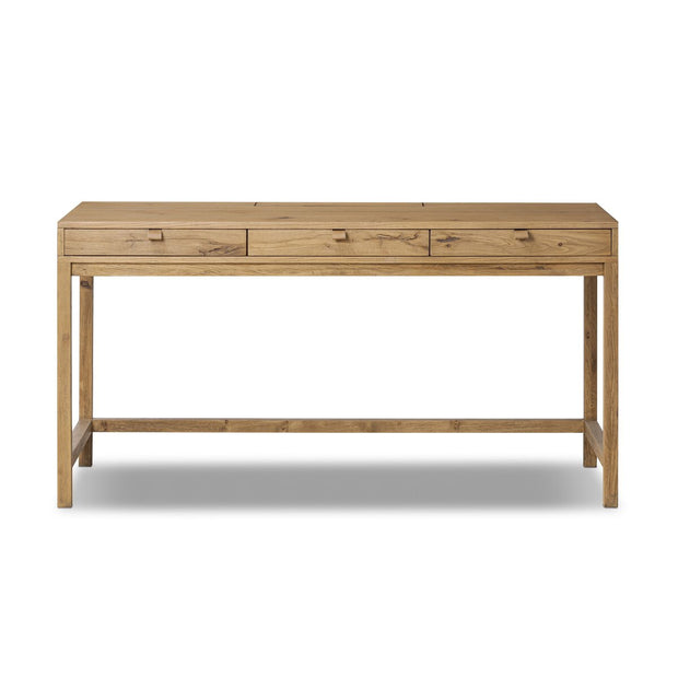 Four Hands Tula Oak Desk with sleek wooden surface and sturdy legs, ideal for modern home or office workspace.