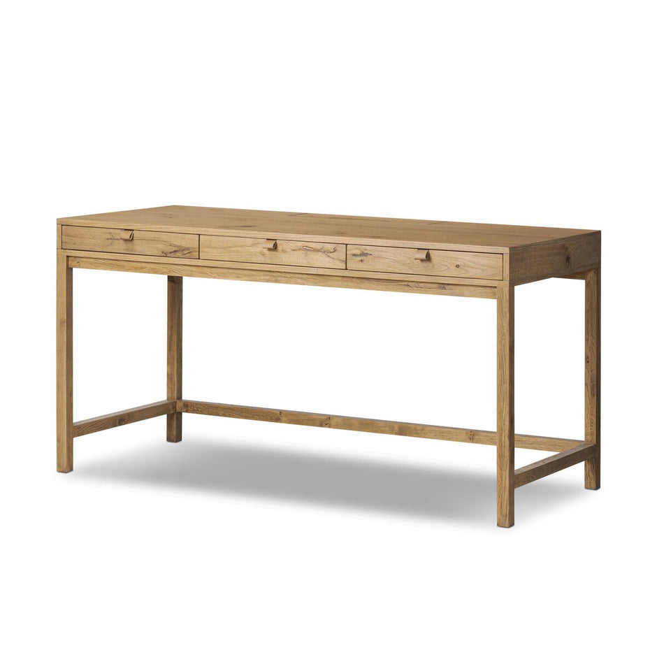 Four Hands Tula Oak Desk with sleek wooden surface and modern design, ideal for home or office workspace.