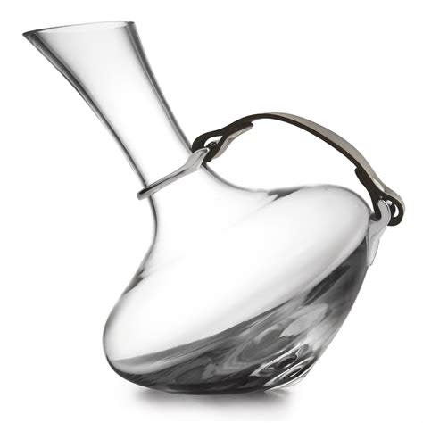 A clear glass wine decanter with a unique shape and a pewter detail with a brown leather strap.