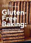 Book cover of 'Gluten-Free Baking' with baked goods on a wooden shelf.
