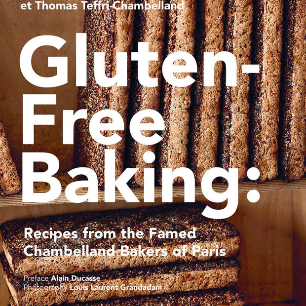 Book cover of 'Gluten-Free Baking' with baked goods on a wooden shelf.