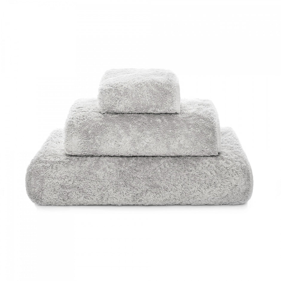Graccioza Egoist hand towel with soft, plush fabric and elegant design, displayed hanging on a towel rack.