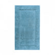 Graccioza Egoist bath rug in beige, 28x47 inches, plush and absorbent, placed on a bathroom floor with soft lighting.