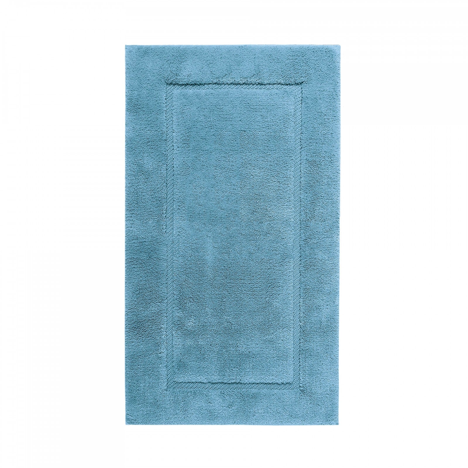 Graccioza Egoist bath rug in beige, 28x47 inches, plush and absorbent, placed on a bathroom floor with soft lighting.