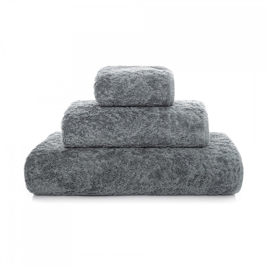 Light gray Graccioza Egoist bath towel with soft, plush texture and elegant design, perfect for luxurious bathroom decor.