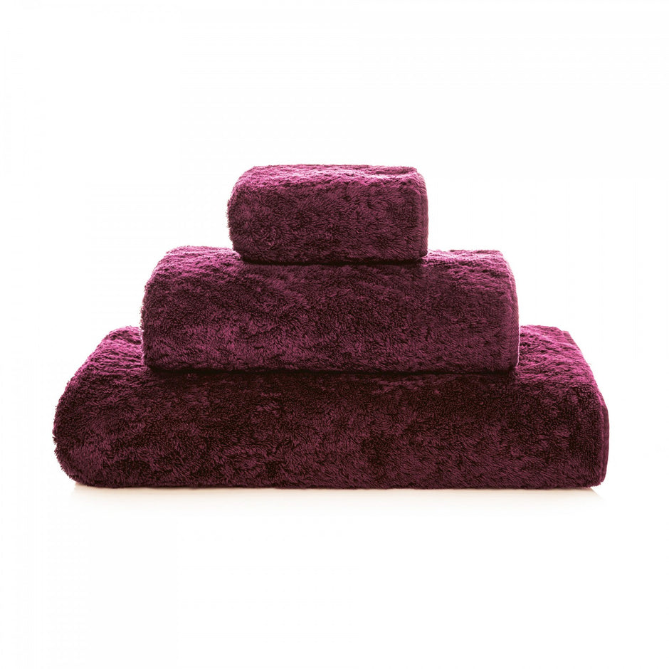 Soft white Graccioza Egoist hand towel with plush texture, displayed folded on a clean bathroom surface.