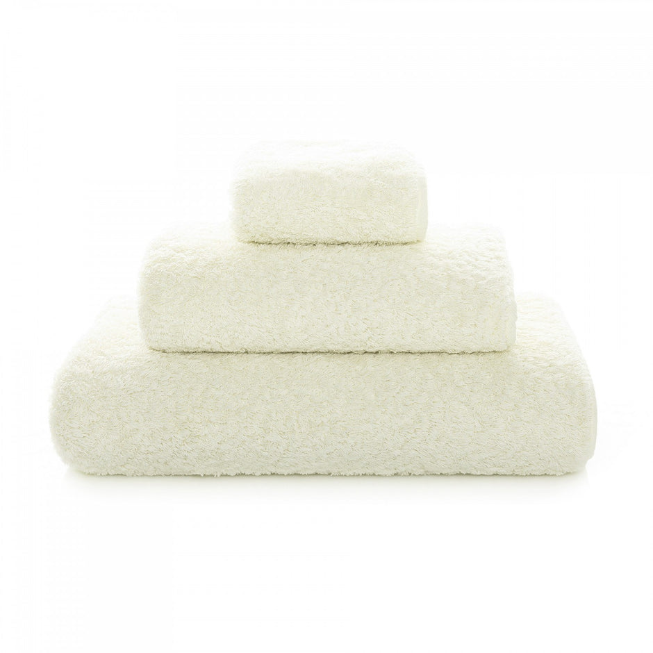 White Graccioza Egoist hand towel with soft, plush texture displayed folded on a bathroom countertop.