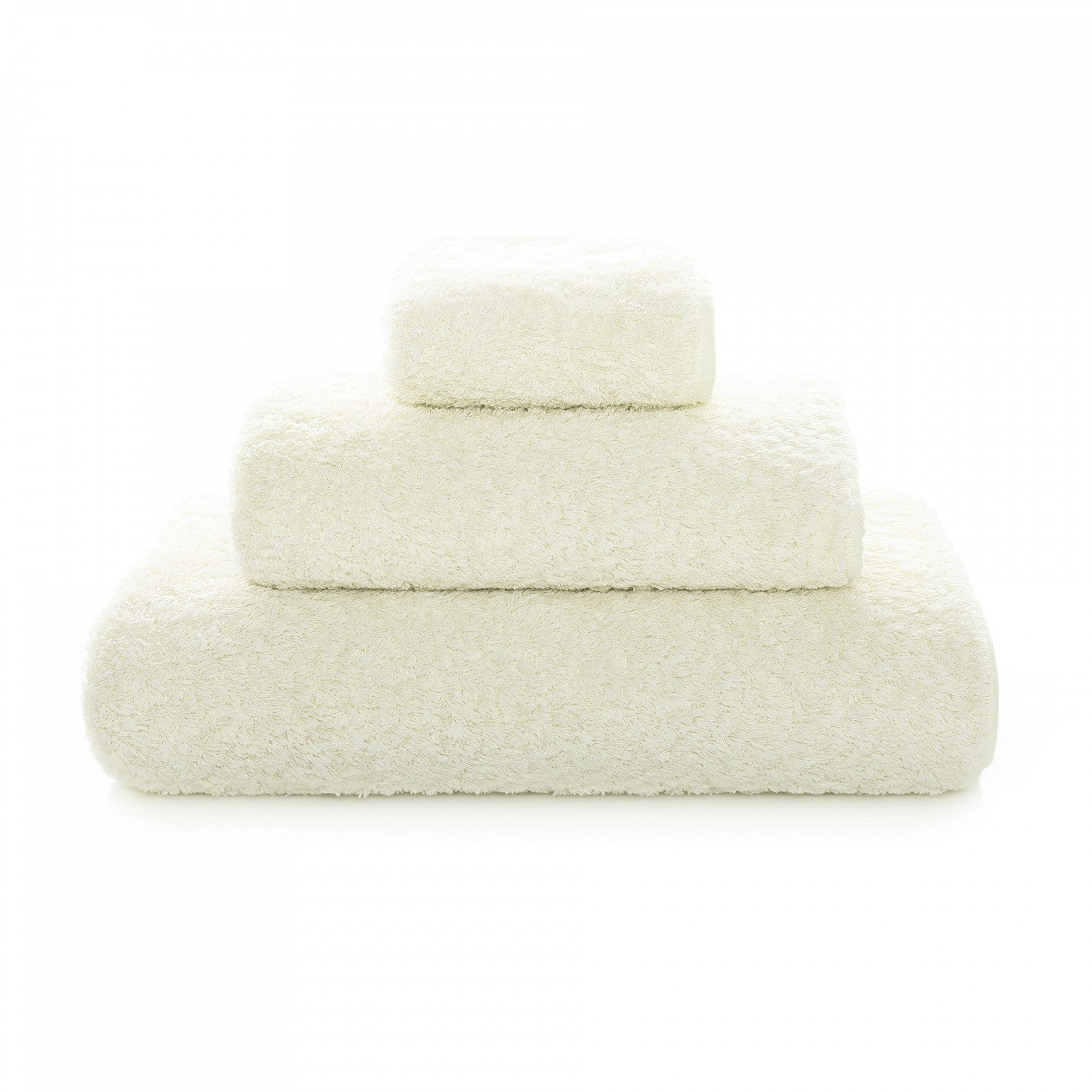 White Graccioza Egoist hand towel with soft, plush texture displayed folded on a bathroom countertop.