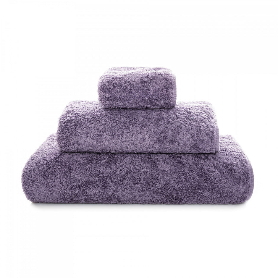Graccioza Egoist hand towel with soft, plush fabric and elegant design, displayed folded on a white surface.