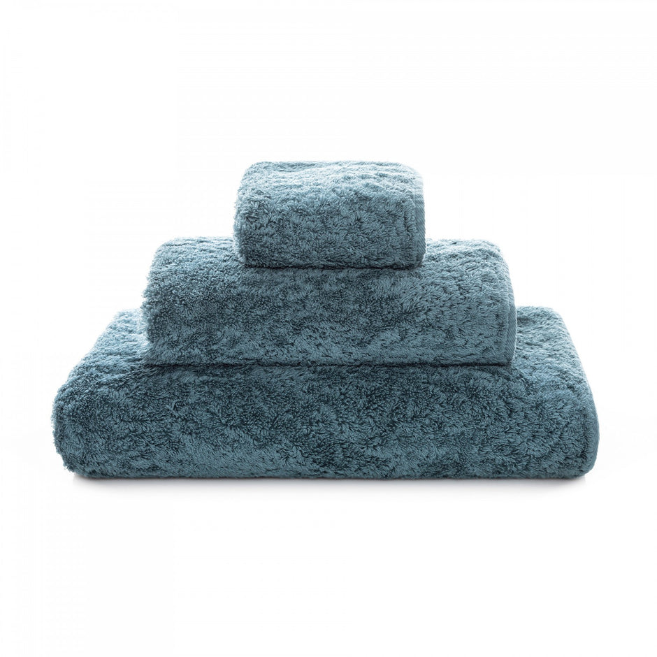 Graccioza Egoist hand towel with soft, plush fabric and elegant design, displayed on a bathroom countertop.