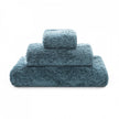 Graccioza Egoist hand towel with soft, plush fabric and elegant design, displayed on a bathroom countertop.