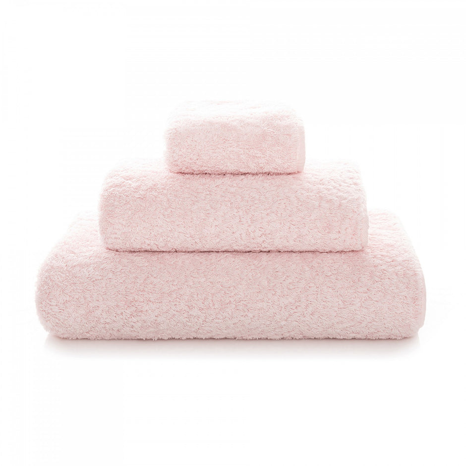 Gray Graccioza Egoist hand towel with textured fabric and folded design, displayed on a bathroom countertop.