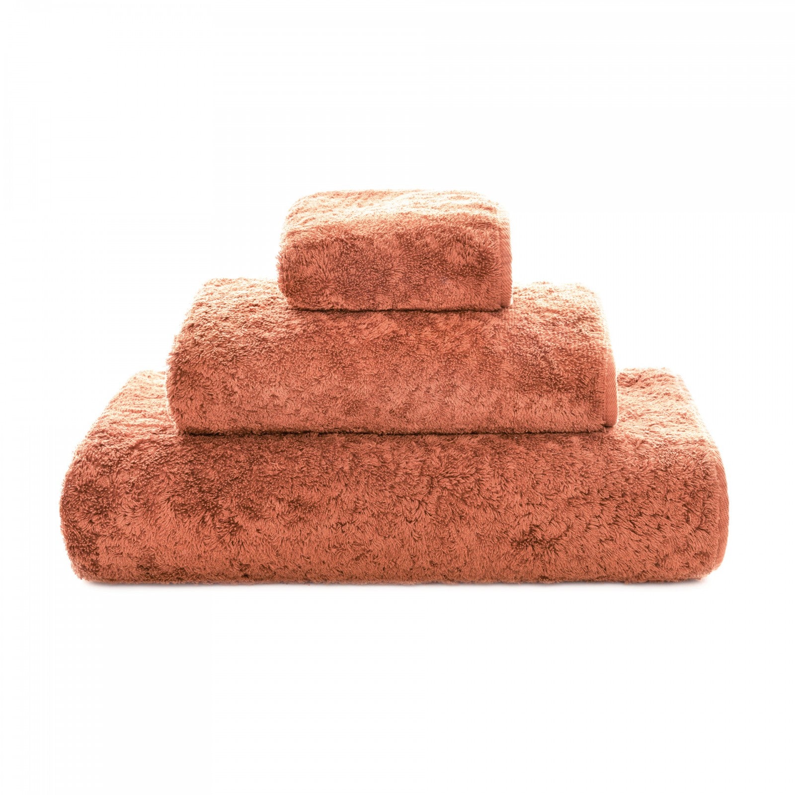 Soft white Graccioza Egoist hand towel with textured weave, displayed folded on a clean bathroom surface.
