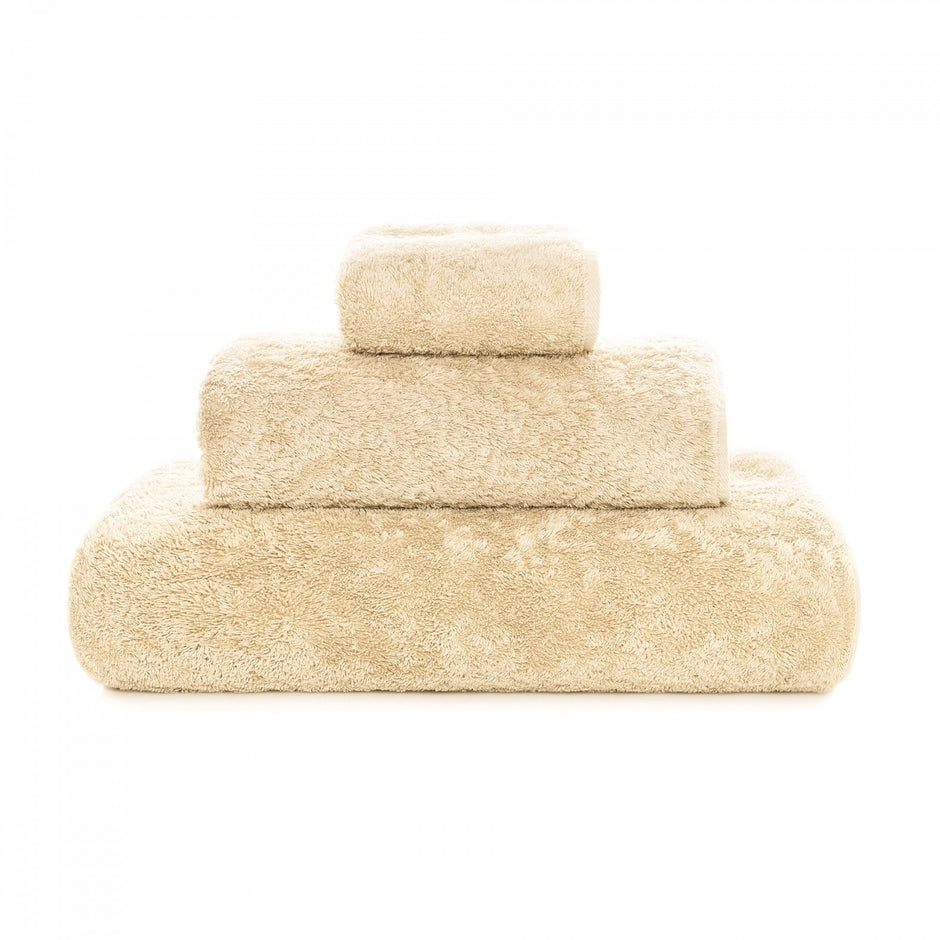 Soft gray Graccioza Egoist hand towel with plush texture, displayed folded on a clean bathroom surface.