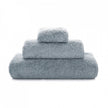 Soft white Graccioza Egoist hand towel with textured weave, displayed folded on a clean bathroom surface.