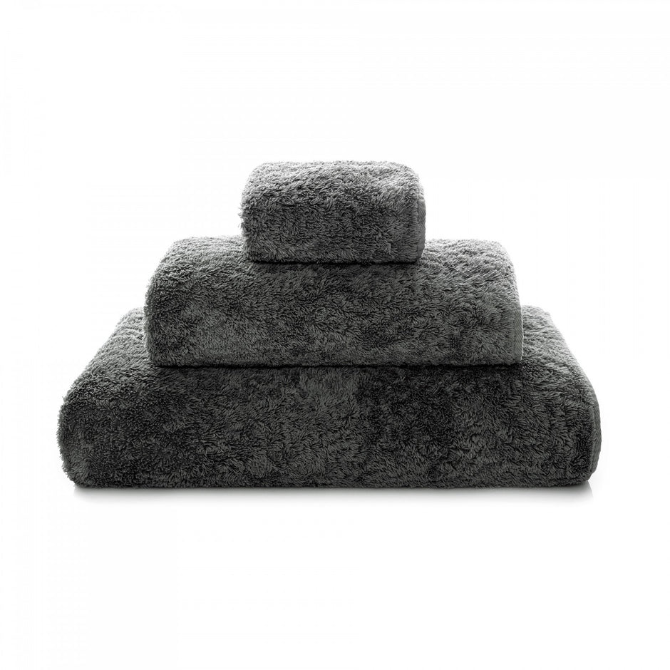 White Graccioza Egoist hand towel with soft, plush fabric, folded neatly to showcase its luxurious texture and quality.
