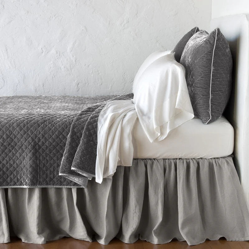 Queen-sized Bella Notte quilted silk velvet coverlet in fog color, featuring a soft, luxurious textured design.