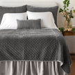 Queen-sized quilted silk velvet coverlet in fog color by Bella Notte, showcasing soft, luxurious fabric and elegant stitching.