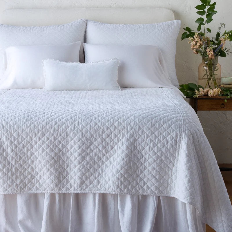 White quilted silk velvet coverlet by Bella Notte, designed for queen and cal king beds, with a luxurious textured finish.